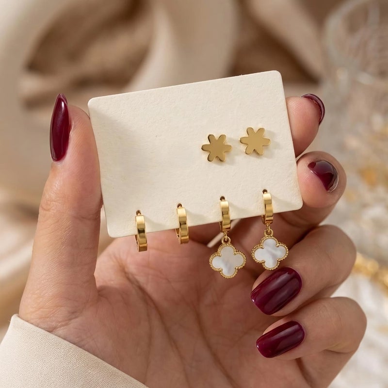 A set of three pairs of gold earrings; combining white mother-of-pearl flower pendants, plain hoops, and rose-shaped gold studs. Made of durable stainless steel, for a perfect look. - Image 4
